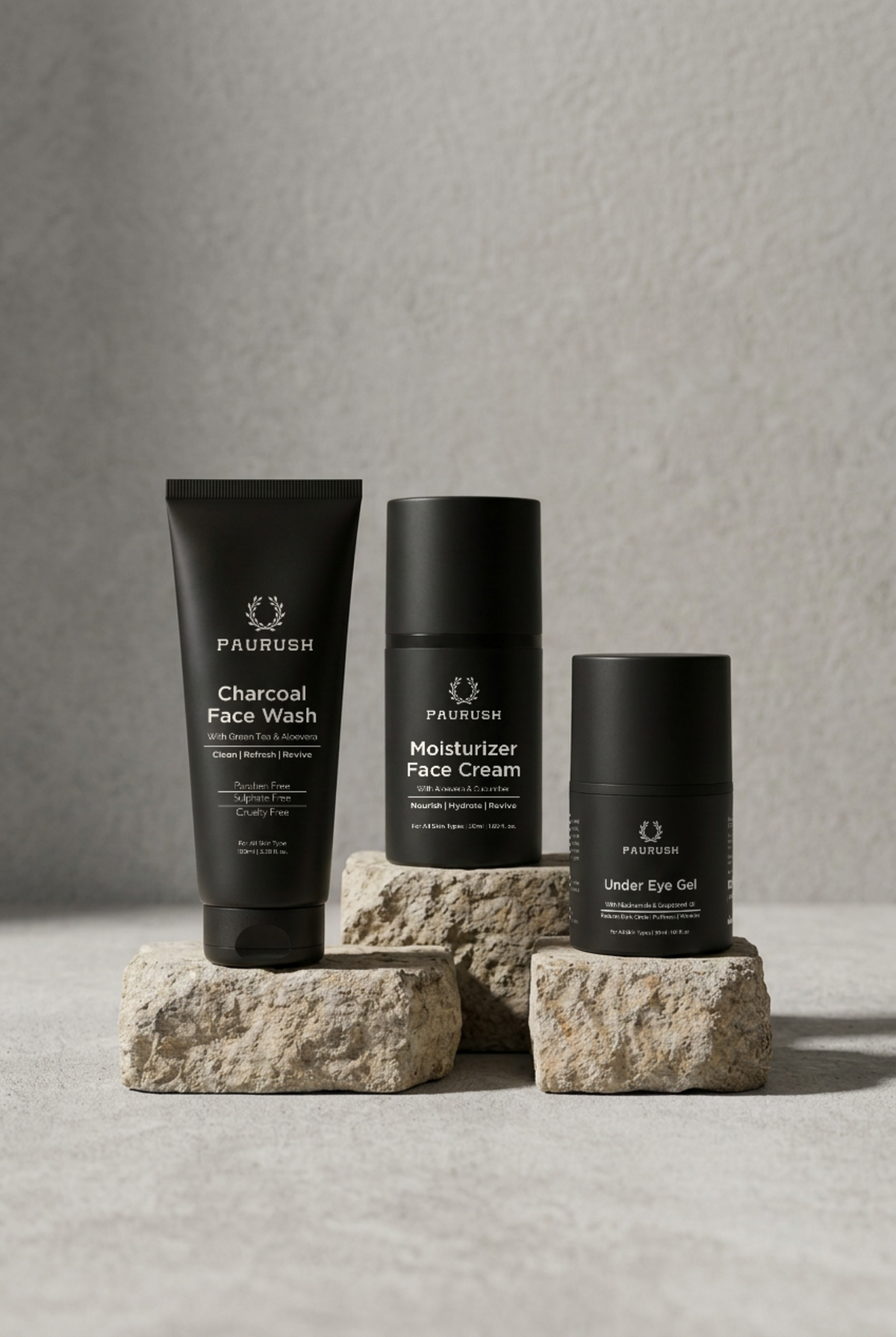 PAURUSH Complete Routine for men: Charcoal Face Wash, Moisturizer Face Cream and Under Eye Gel on stone blocks